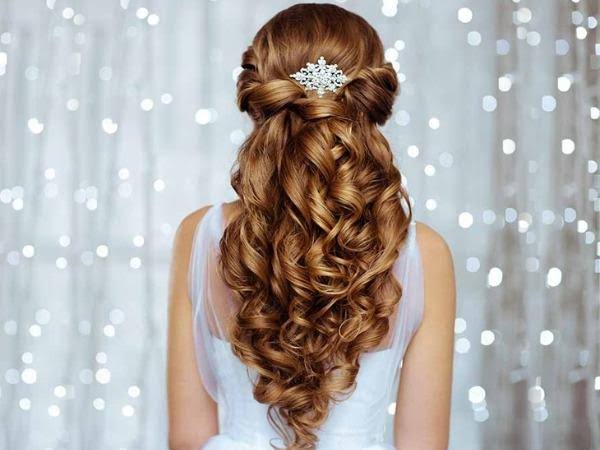 Twisted half updo and curls with a pearl hairpin