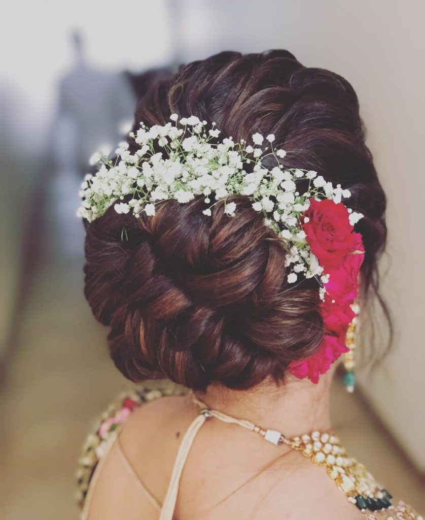 Bun with artificial flowers 